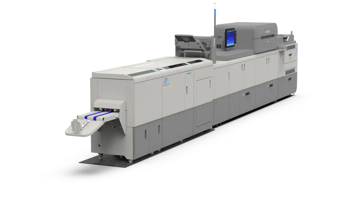 Official current PBM5000 page hero showing complete PBM5000 system inline with a Ricoh C9210. This is older printer context and must not be labelled C9500/C7500.