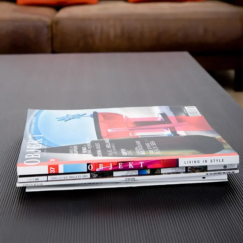 Stack of glossy printed magazines/catalogues