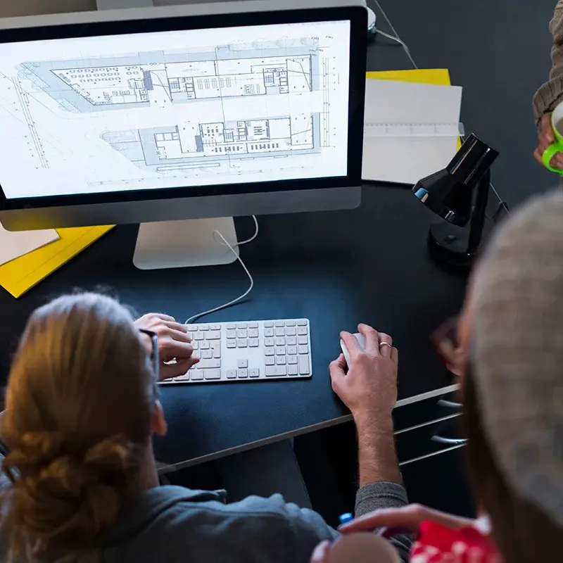 Architectural plan displayed on office monitor