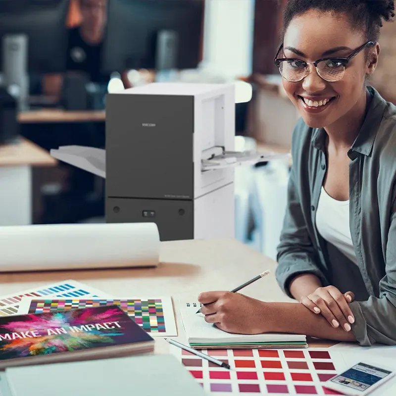 Colour-print worker holding a sample