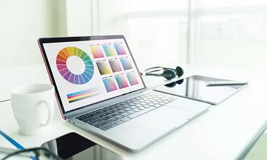 Laptop with colour-management charts and software