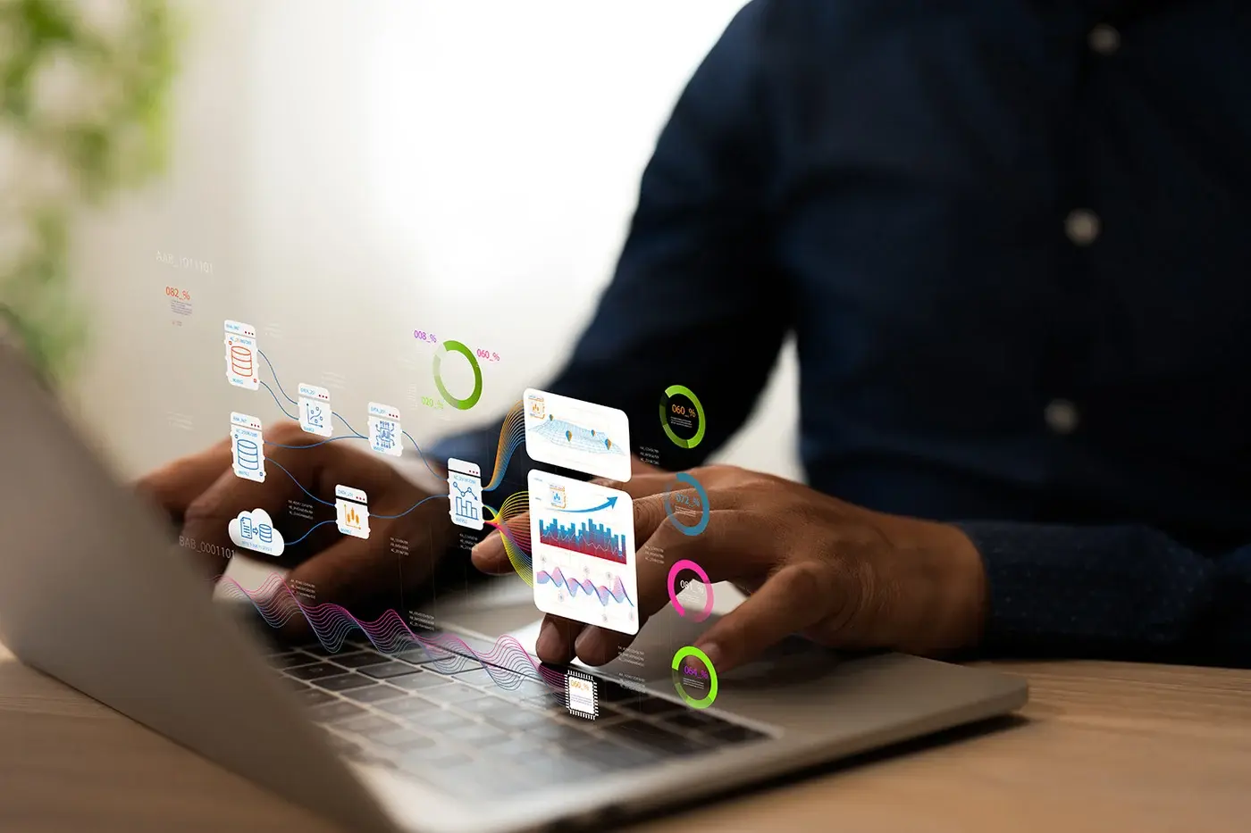 Laptop user with digital application icons