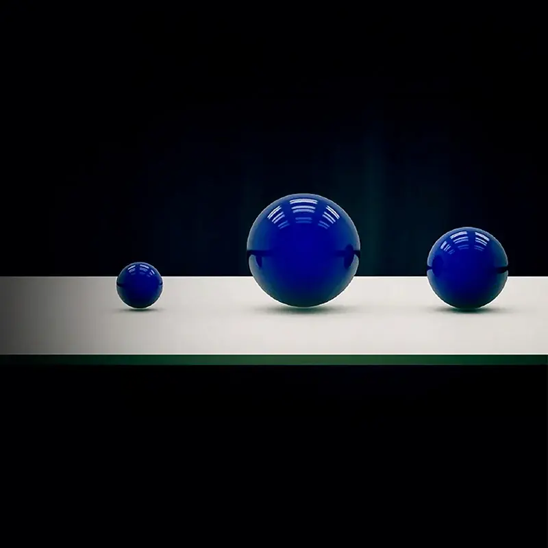 Three blue droplets/spheres used to illustrate variable ink-drop technology