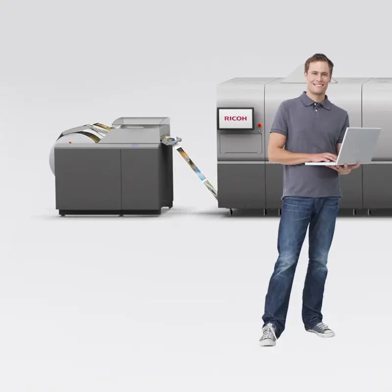 Operator with laptop beside VC70000 equipment from shared family page