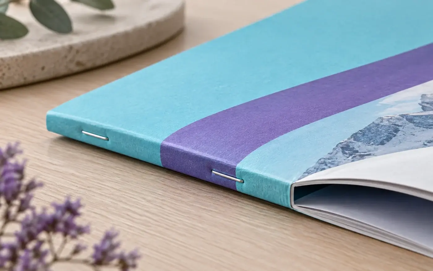 Illustration: Close-up of a squared saddle-stapled booklet spine.