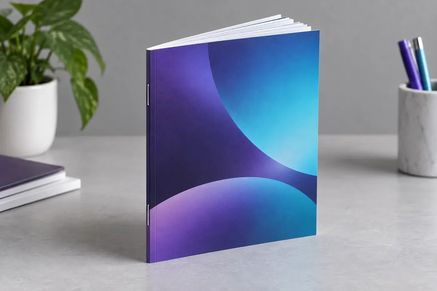 Illustration: A square-spine stapled booklet standing on edge with a clean face trim.