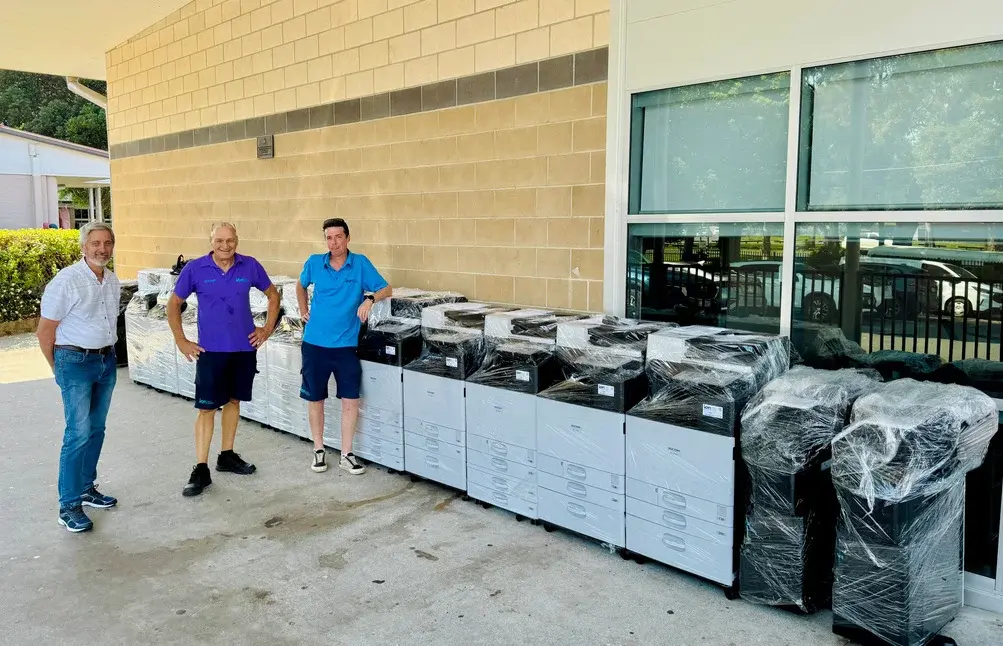 School and ion representatives beside the Ricoh devices delivered to Palm Beach Currumbin State High School